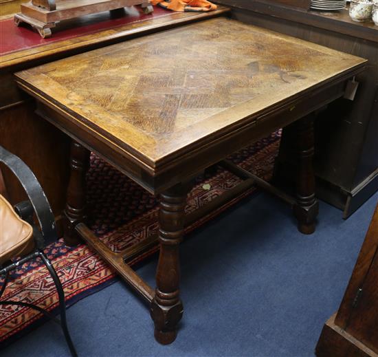 A draw leaf oak table W.94cm